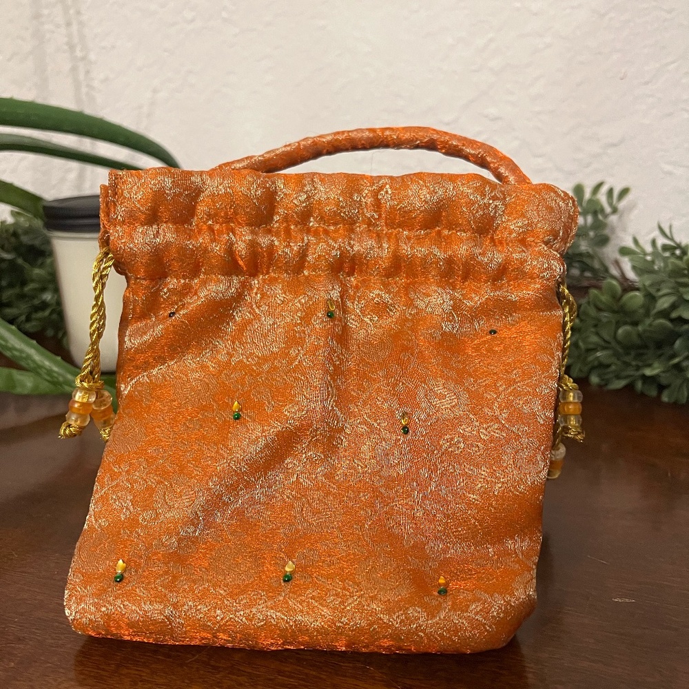Fancy small orange purse